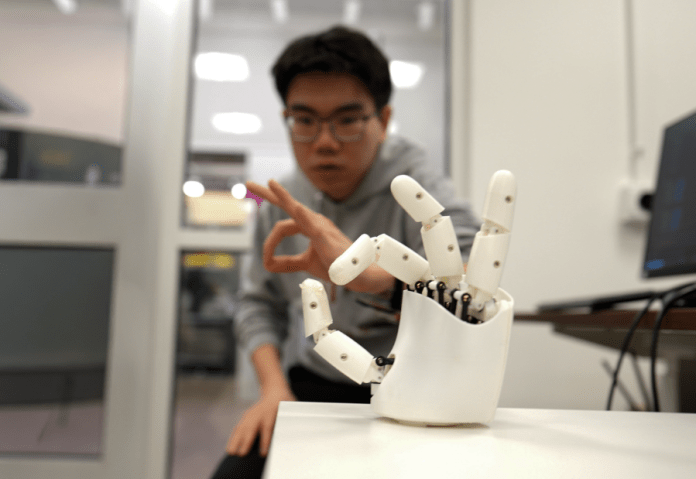 AI-powered wristband enables natural control of robotic hands